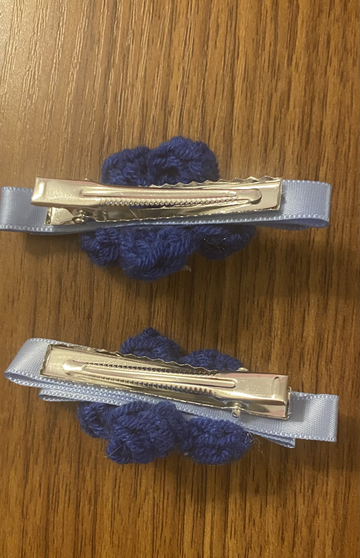 Navy crochet flower clips — hardware detail